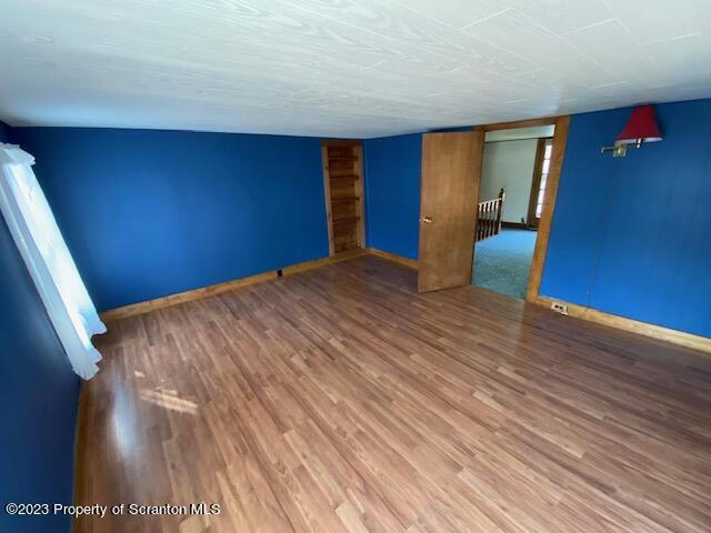 220 Main Street Laceyville, PA 18623 - Photo 17 of 39 a view of an empty room with wooden floor and a window