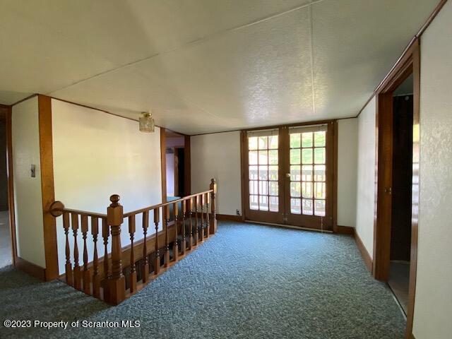 220 Main Street Laceyville, PA 18623 - Photo 20 of 39 a view of livingroom with stairs and a floor to ceiling window