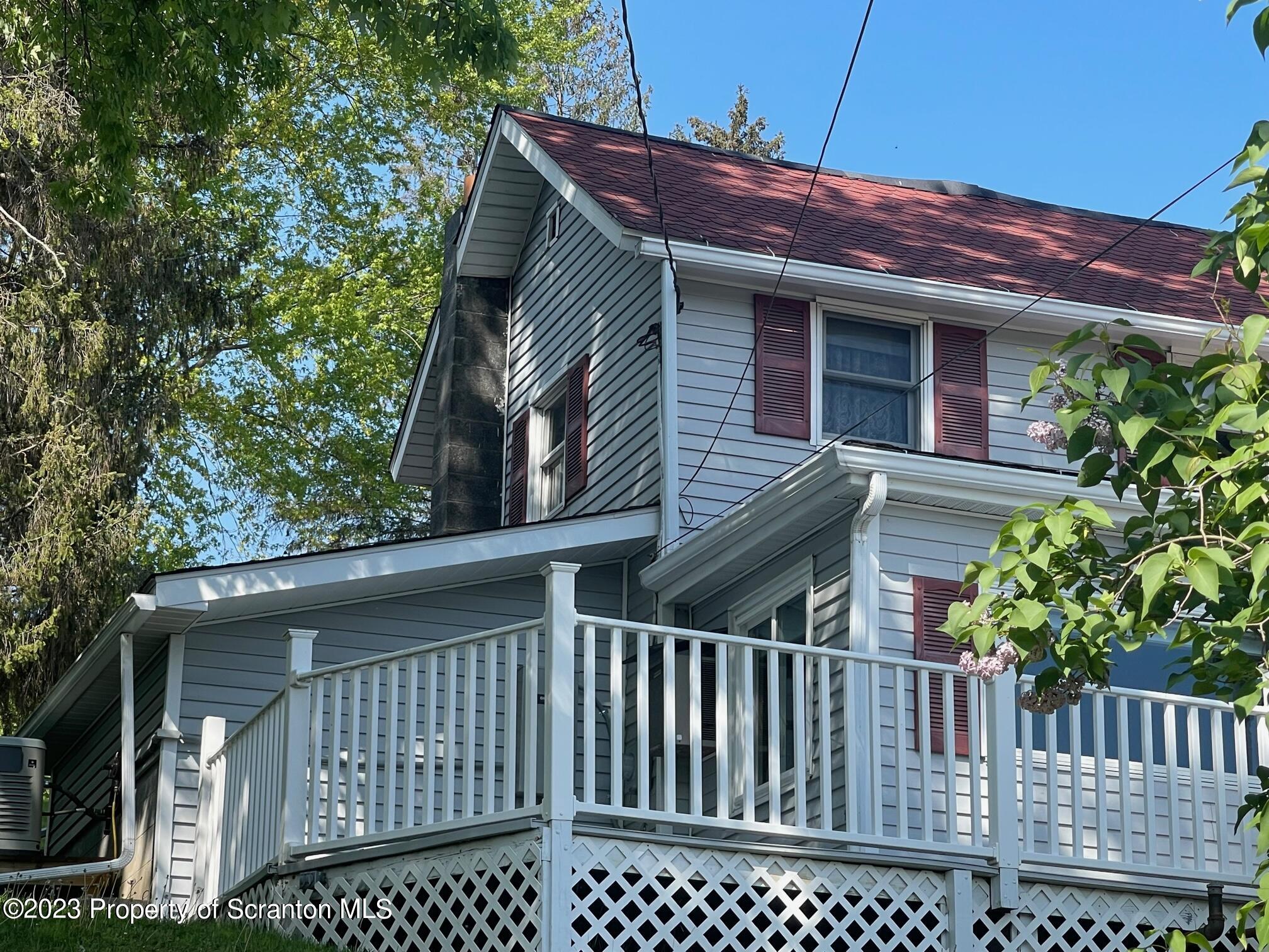 220 Main Street Laceyville, PA 18623 - Photo 27 of 39 a front view of a house with a garden