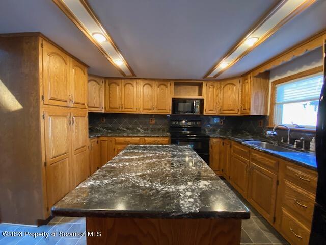 220 Main Street Laceyville, PA 18623 - Photo 7 of 39 a large kitchen with stainless steel appliances granite countertop wooden cabinets a stove a sink and a window