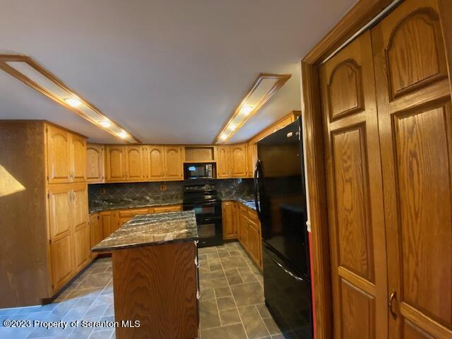 220 Main Street Laceyville, PA 18623 - Photo 8 of 39 a view of a kitchen with a refrigerator