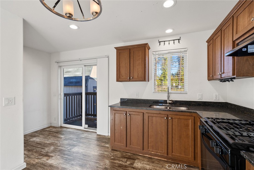 6328 Diamond Paradise, CA 95969 - Photo 11 of 31 a kitchen with granite countertop a stove and a sink