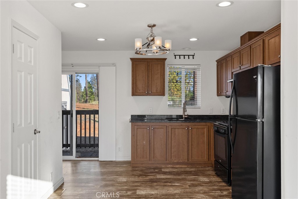 6328 Diamond Paradise, CA 95969 - Photo 10 of 31 a kitchen with granite countertop stainless steel appliances a refrigerator and a sink