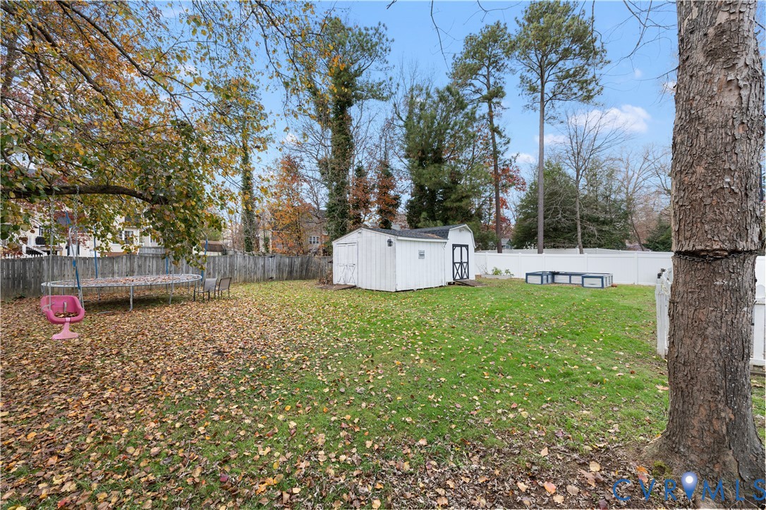 7736 Secretariat Drive Midlothian, VA 23112 - Photo 29 of 35 a backyard of a house with lots of green space
