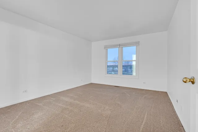 a bathroom with a double vanity sink mirror and shower