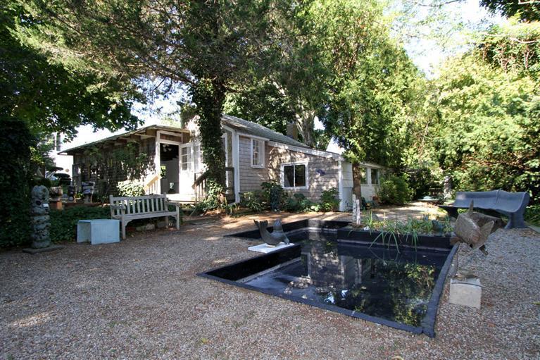 40 Main Street Wellfleet, MA 02667 - Photo 13 of 35 a view of a house with backyard and sitting area