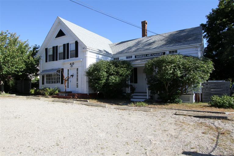 40 Main Street Wellfleet, MA 02667 - Photo 2 of 35 a house with trees in front of it