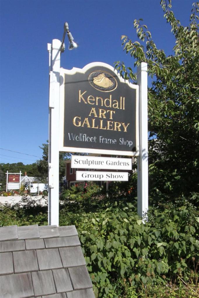 40 Main Street Wellfleet, MA 02667 - Photo 3 of 35 a sign that is on the side of a building