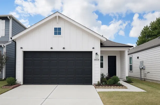 a front view of a house with garage