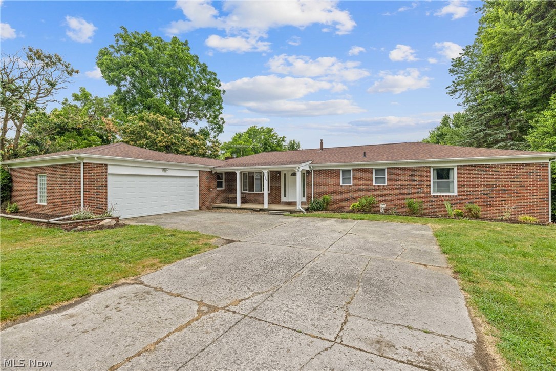 16295 Sperry Road Vermilion, OH 44089 - Photo 2 of 48 Single story home with a garage and a front lawn