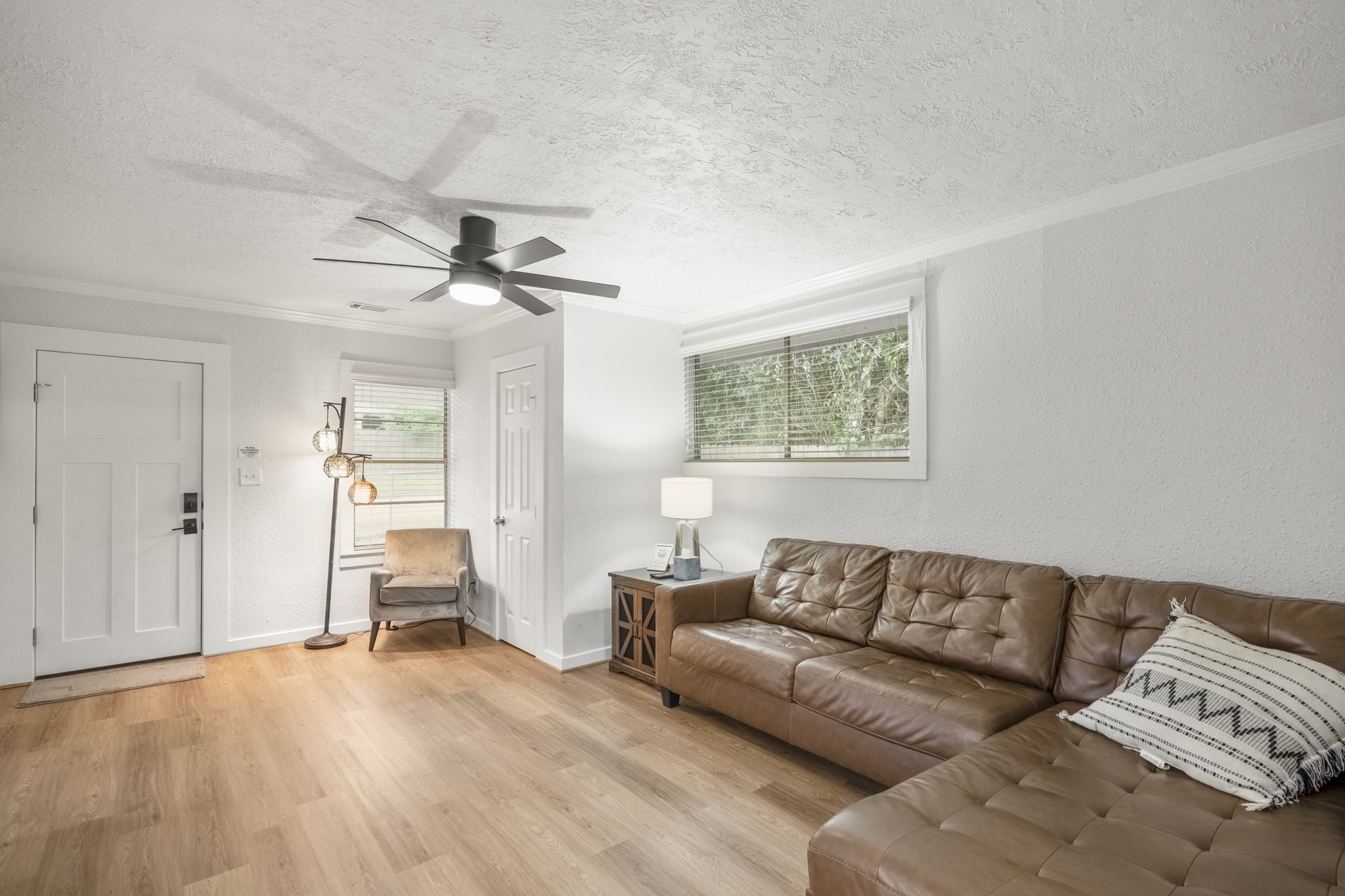 206 Murray Street Conroe, TX 77301 - Photo 11 of 38 a living room with furniture and a ceiling fan