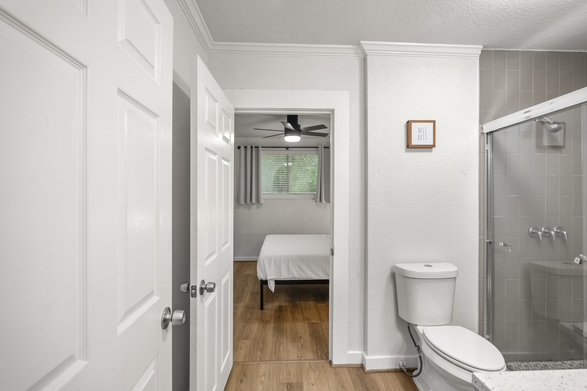 206 Murray Street Conroe, TX 77301 - Photo 16 of 38 a bathroom with a toilet and a shower