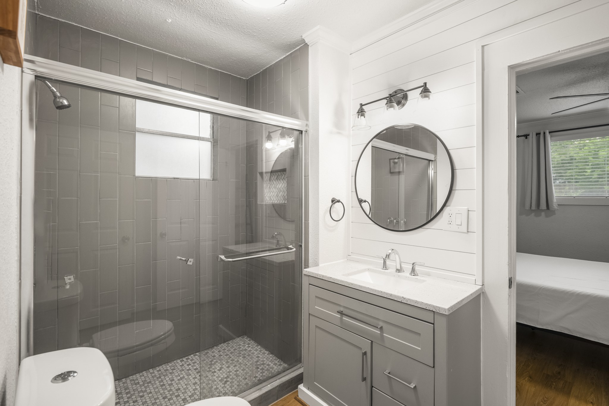 206 Murray Street Conroe, TX 77301 - Photo 17 of 38 a bathroom with a granite countertop sink toilet and shower