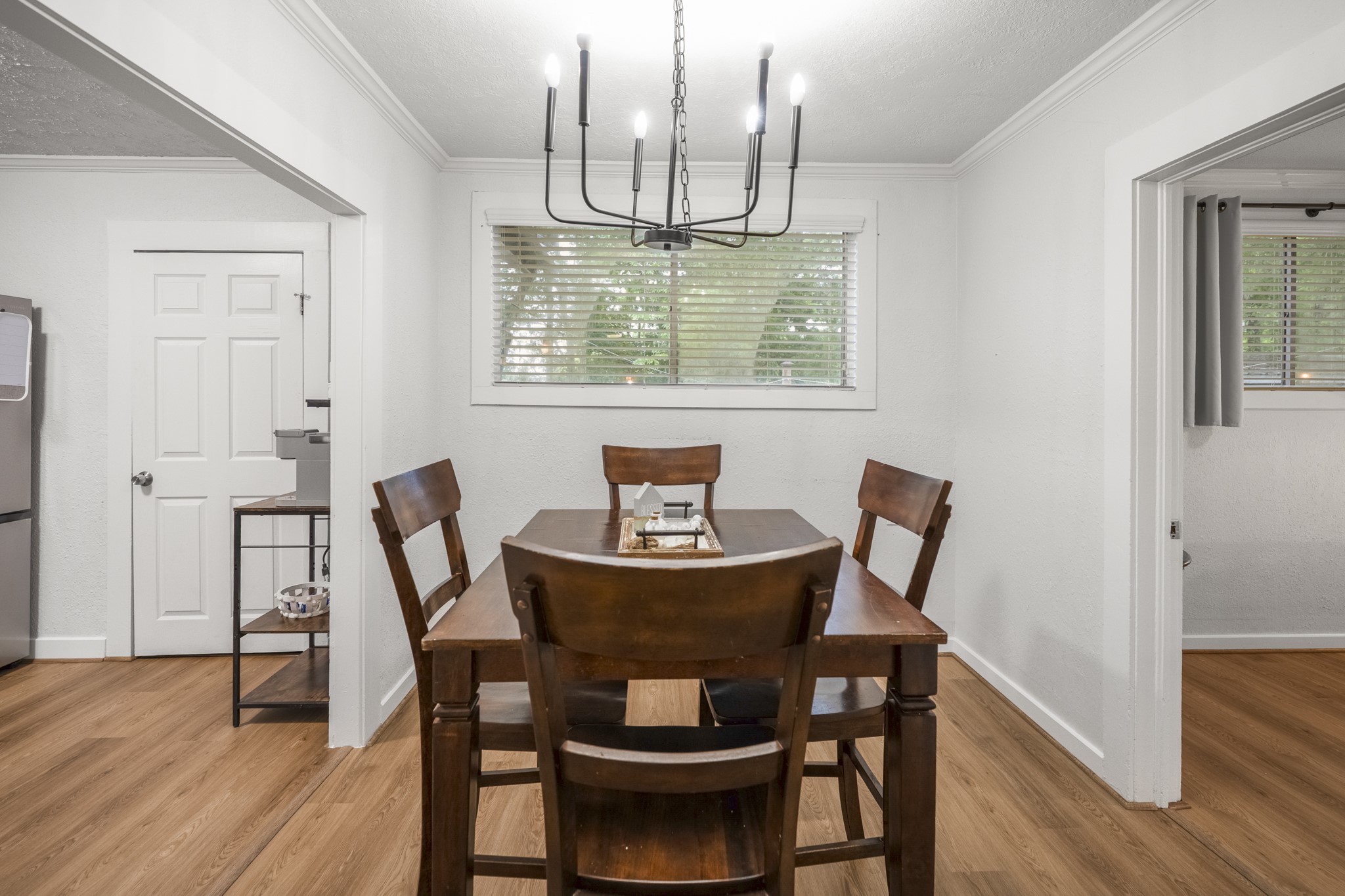 206 Murray Street Conroe, TX 77301 - Photo 21 of 38 a view of a dining room with furniture and wooden floor
