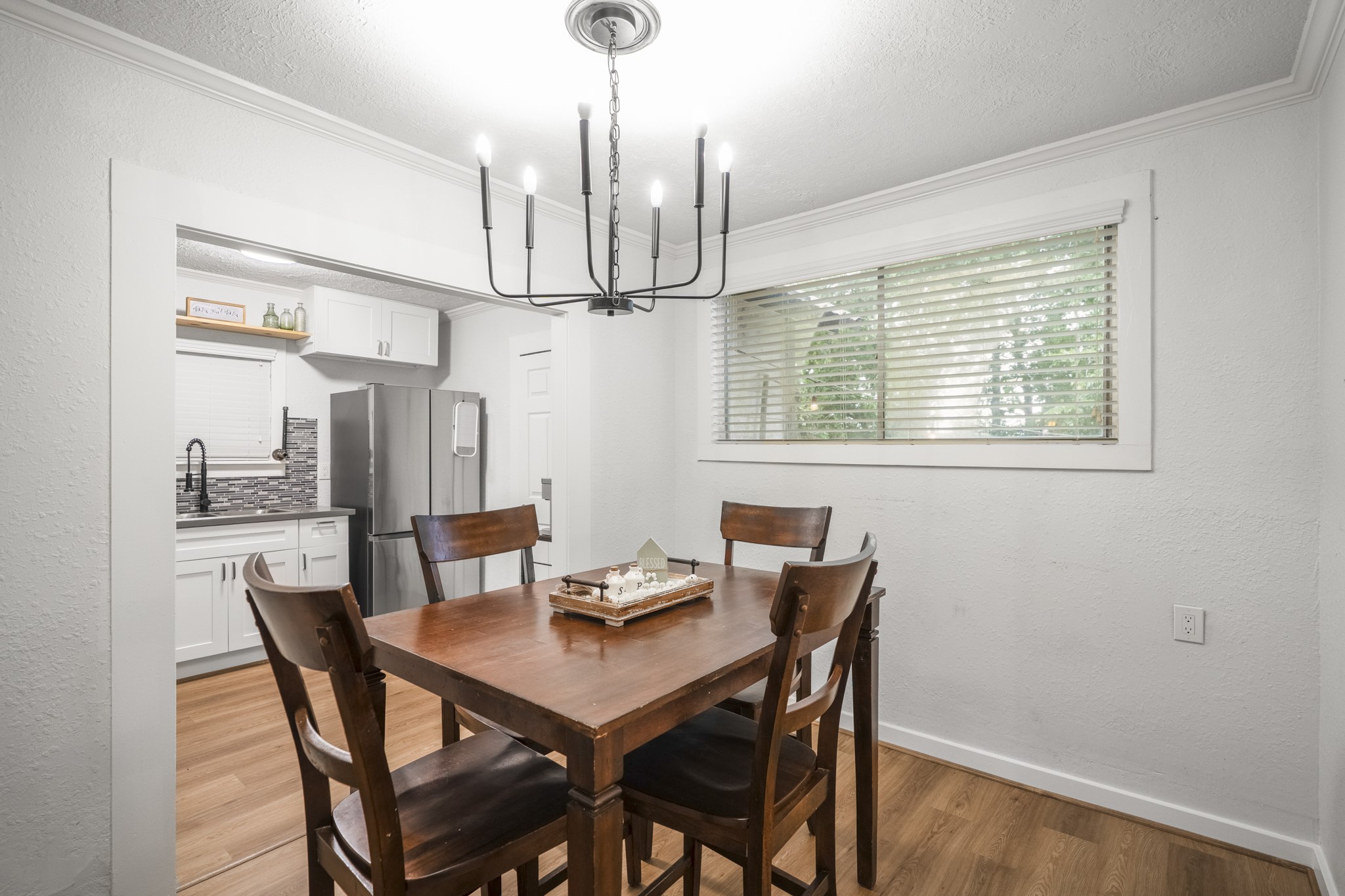 206 Murray Street Conroe, TX 77301 - Photo 23 of 38 a view of a dining room with furniture window and wooden floor