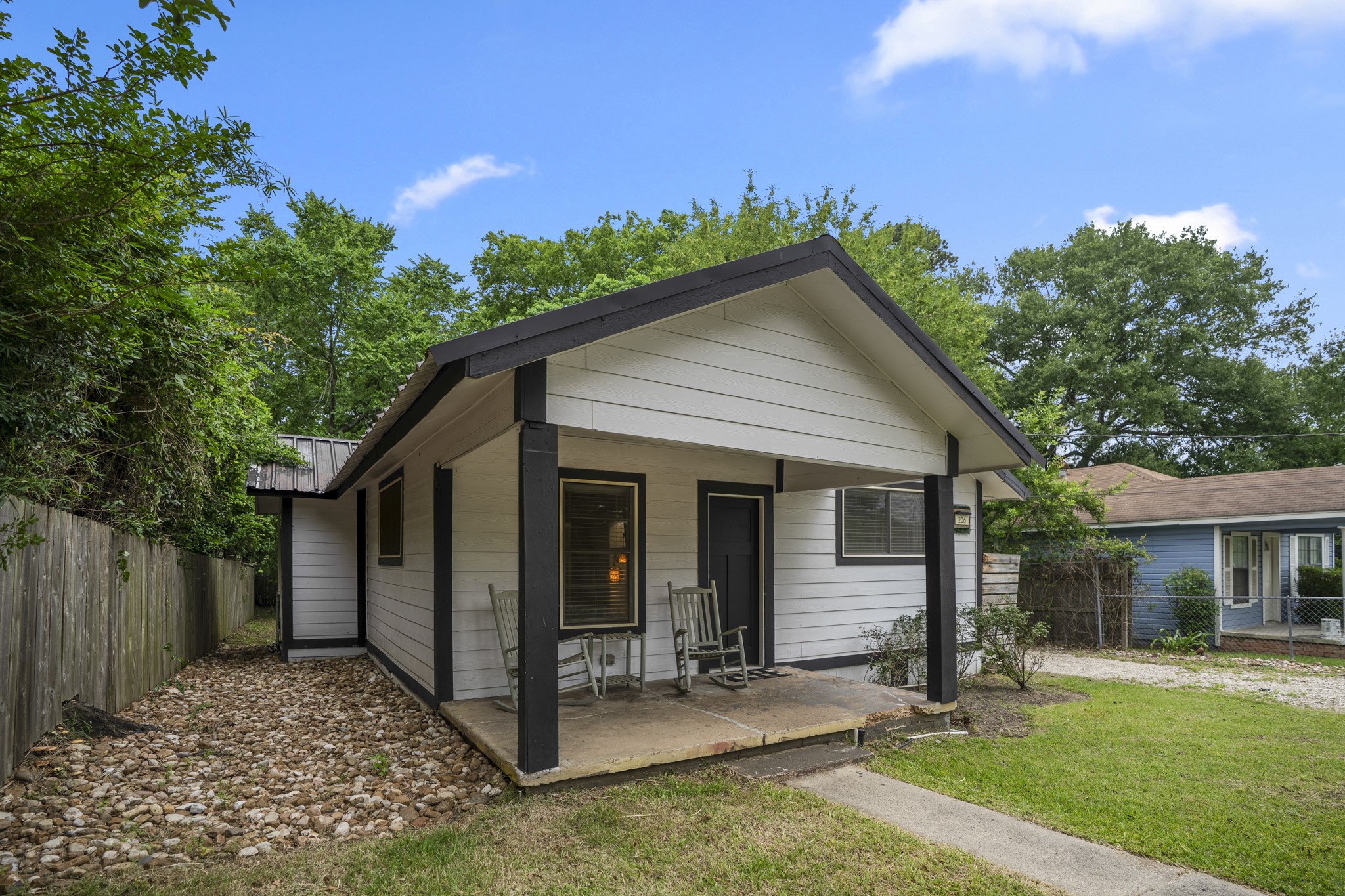 206 Murray Street Conroe, TX 77301 - Photo 3 of 38 front view of a house with a yard