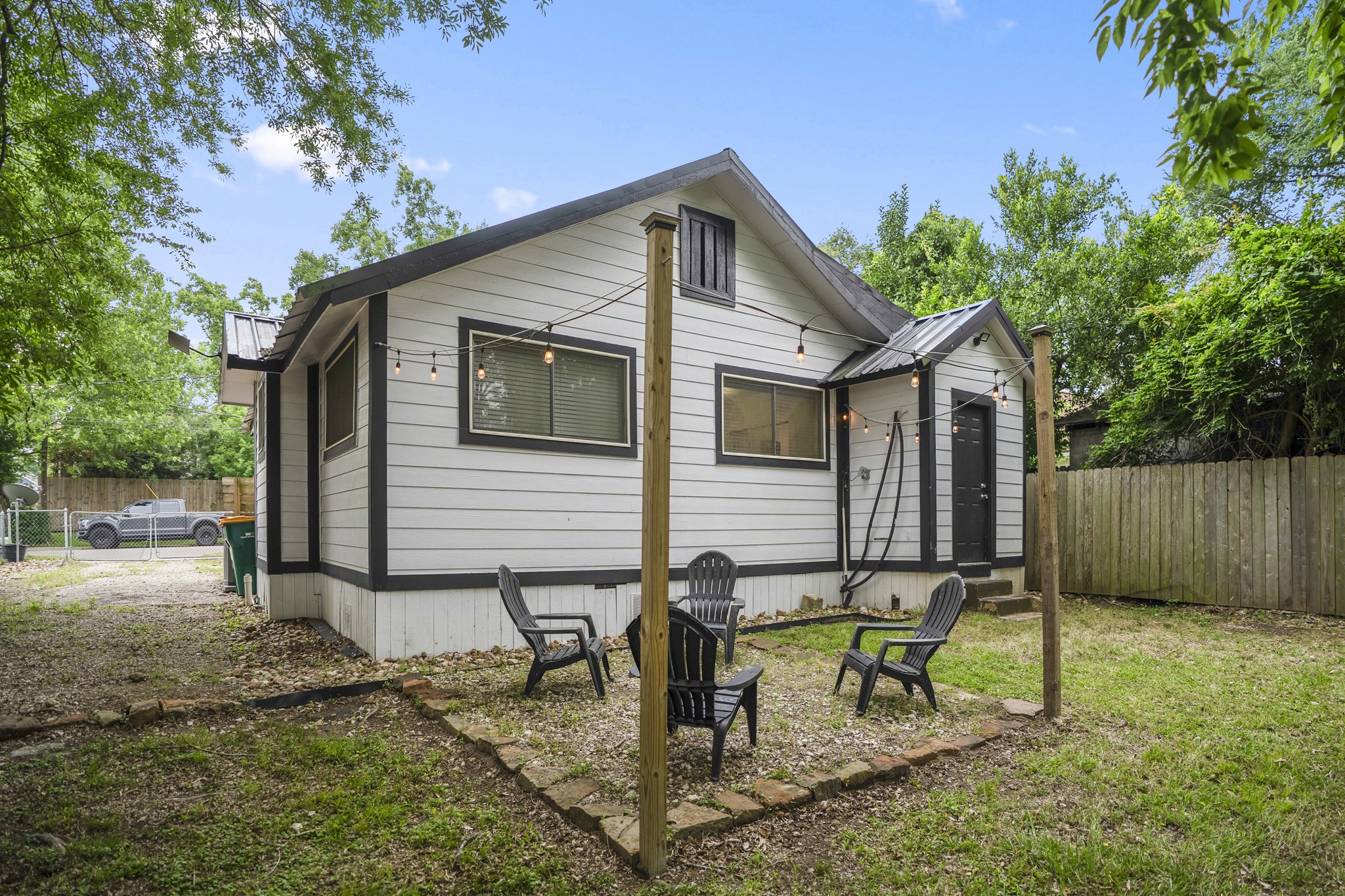 206 Murray Street Conroe, TX 77301 - Photo 34 of 38 a view of a house with backyard and sitting area