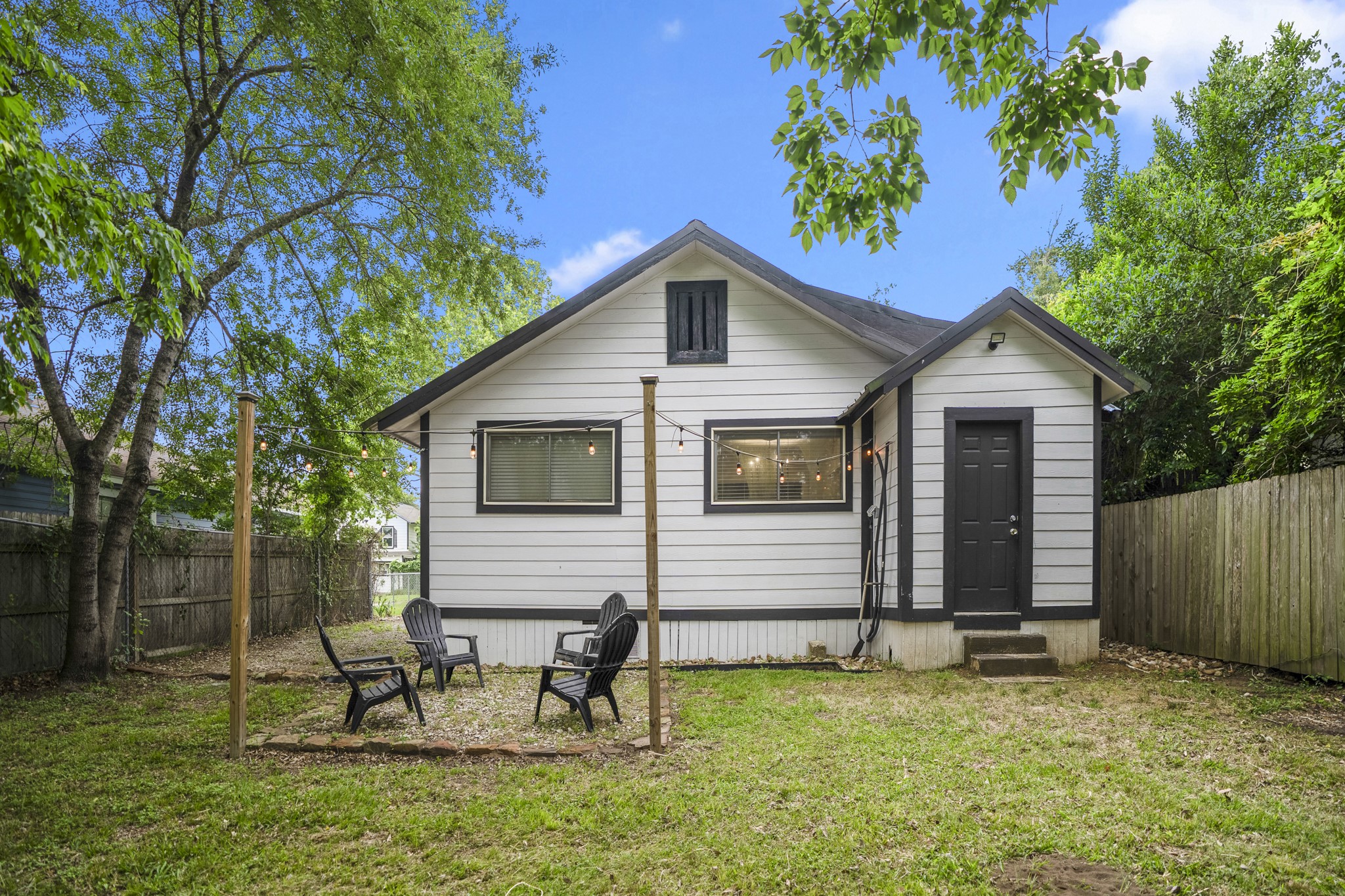 206 Murray Street Conroe, TX 77301 - Photo 35 of 38 a backyard of a house with table and chairs