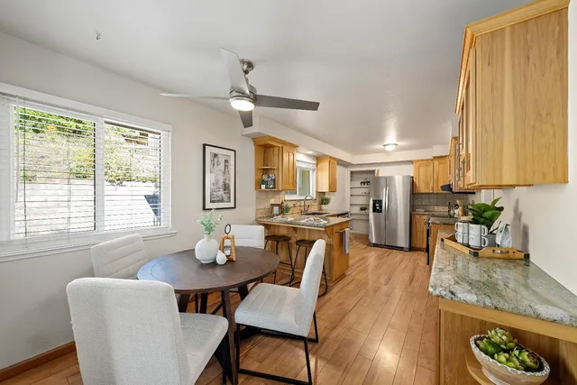 a view of a dining room with furniture window and wooden floor