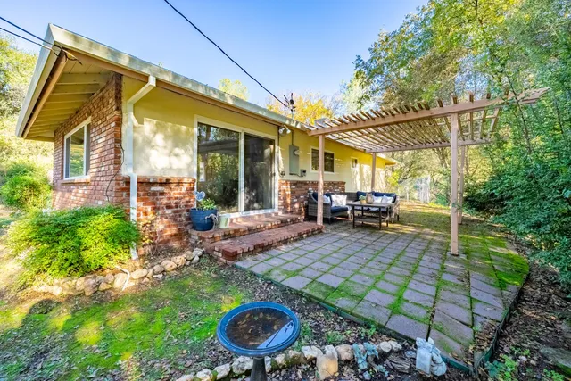 a view of yard with patio