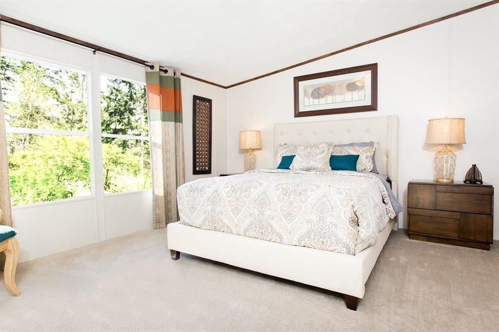 107 Valley Street Bridgeport, TX 76426 - Photo 6 of 9 a spacious bedroom with a bed and a window