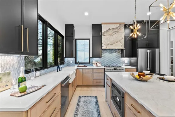 a kitchen with a sink a stove and cabinets