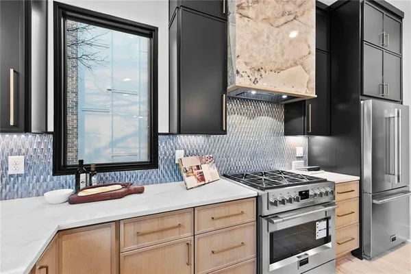 a kitchen with a stove a sink and a refrigerator