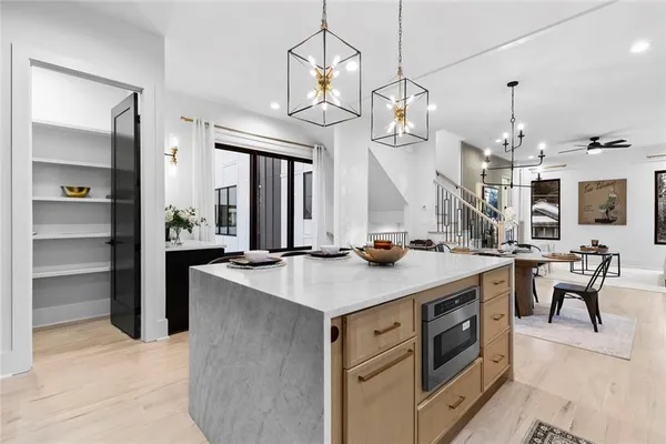 a kitchen with stainless steel appliances a refrigerator and a sink