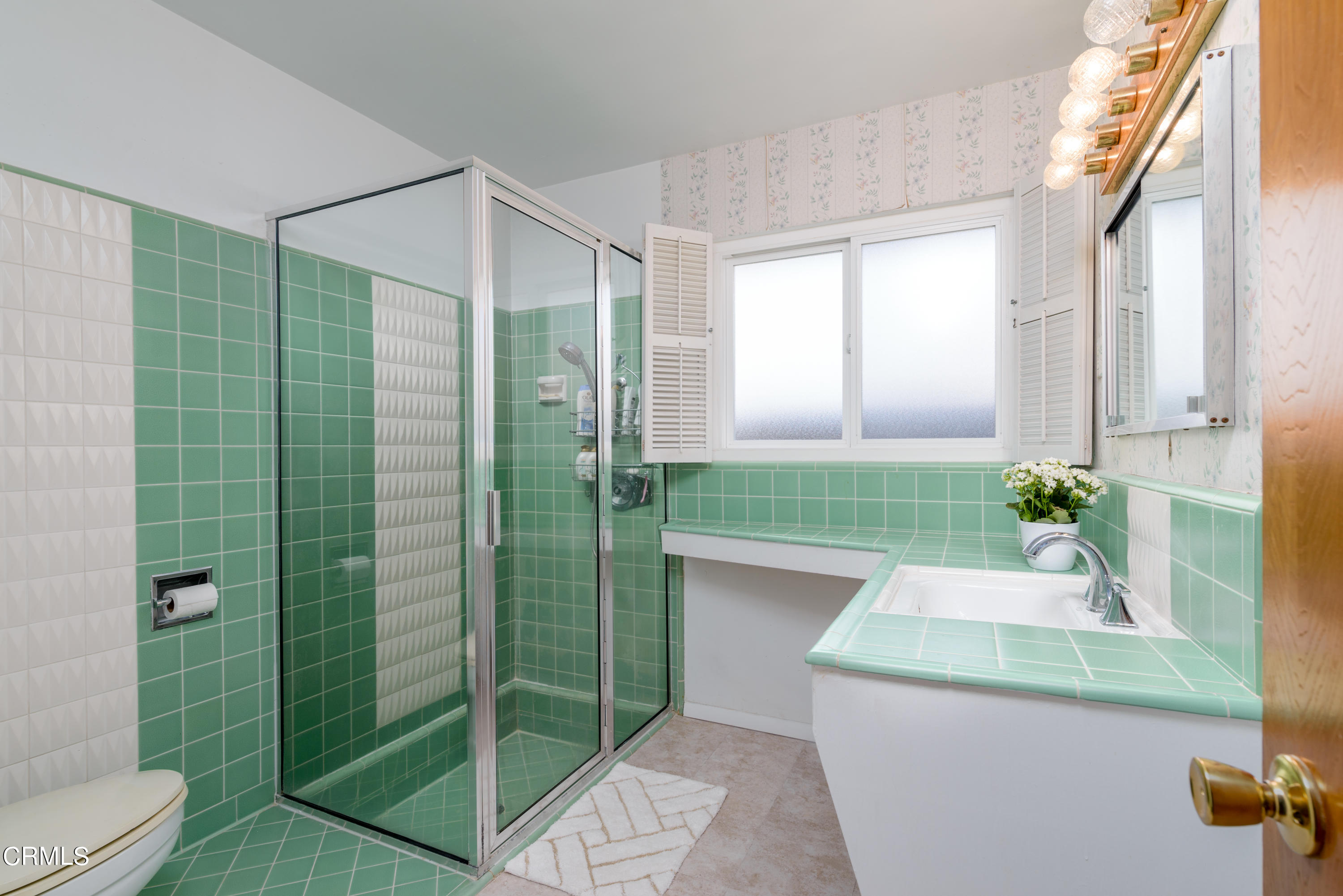 1126 West Roderick Avenue Oxnard, CA 93030 - Photo 14 of 28 a bathroom with a sink and a mirror