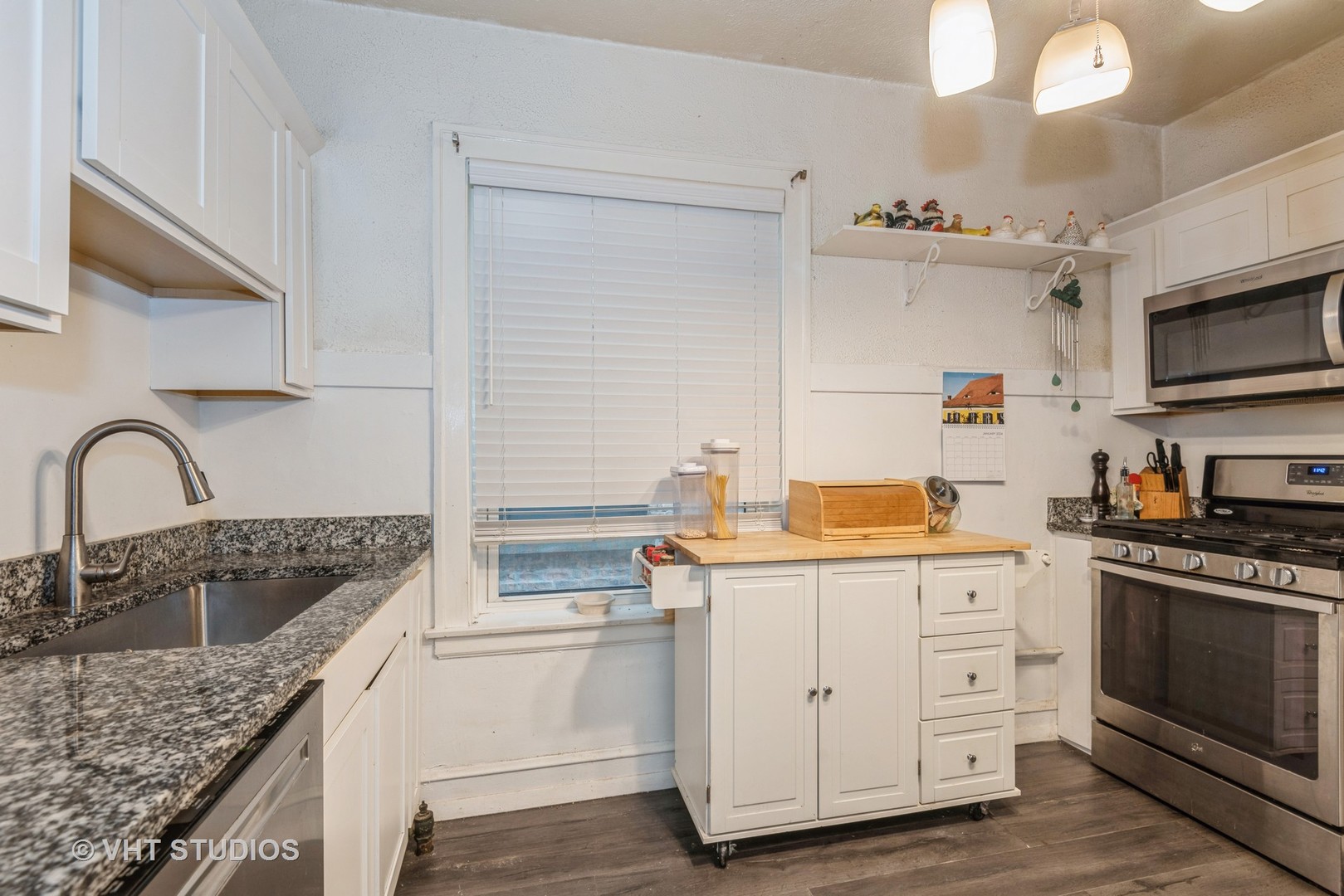 528 Sheridan Road, Unit 1A Evanston, IL 60202 - Photo 4 of 10 a kitchen with stainless steel appliances granite countertop a sink stove and cabinets