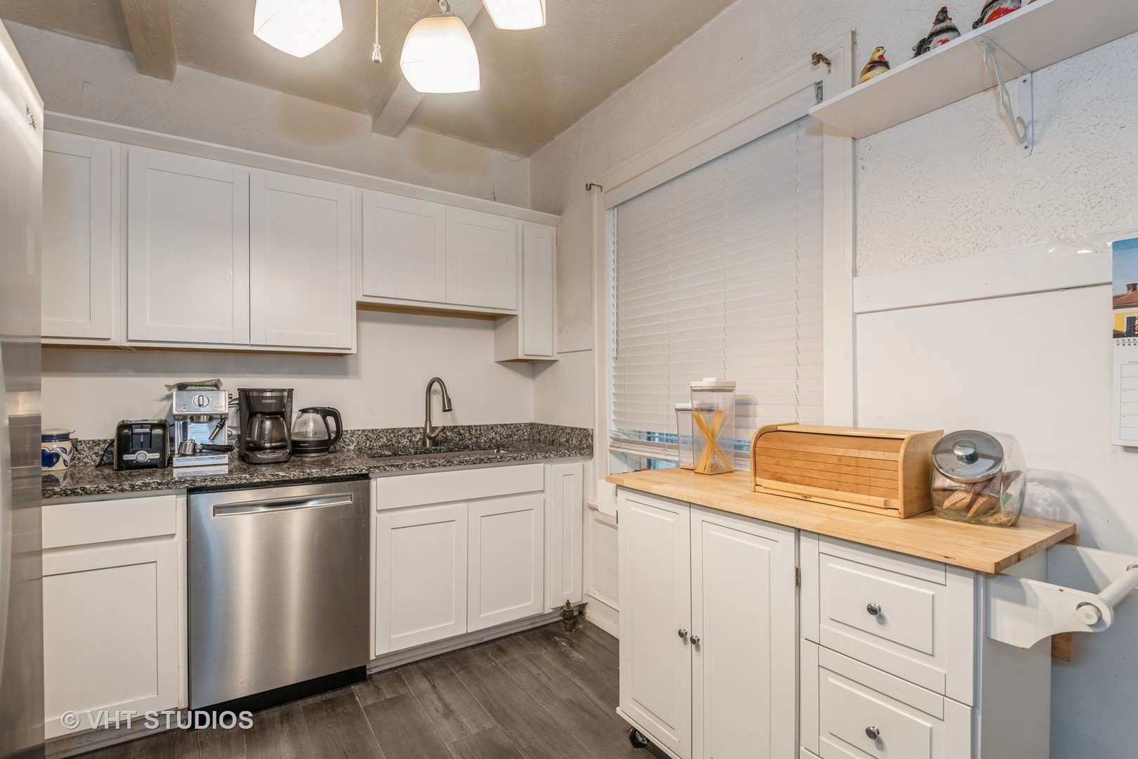 528 Sheridan Road, Unit 1A Evanston, IL 60202 - Photo 5 of 10 a kitchen with white cabinets sink and appliances