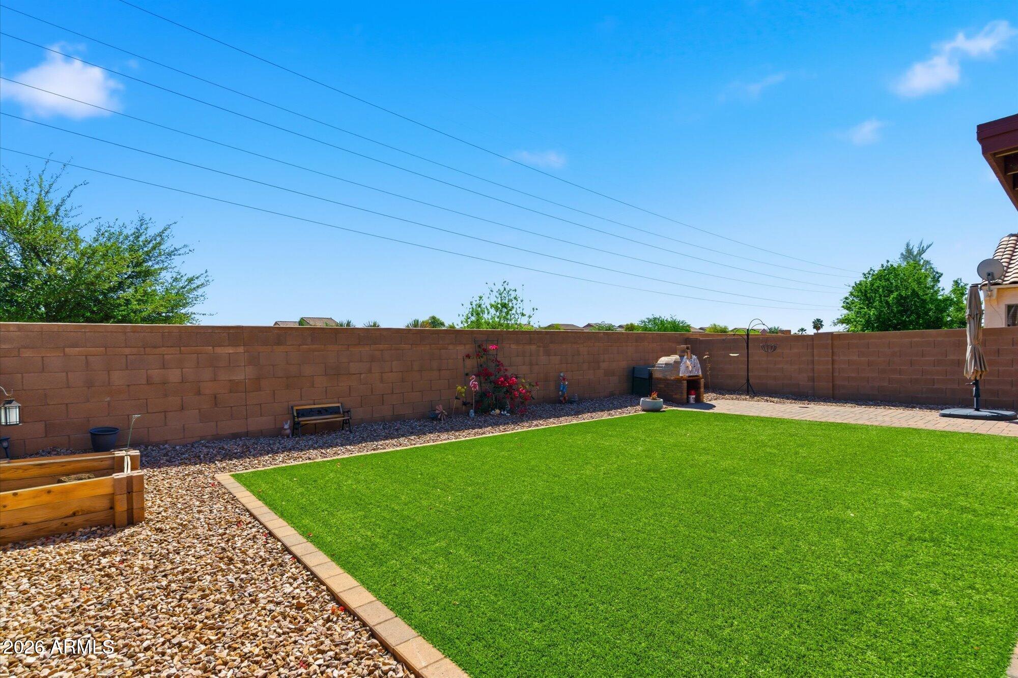 21915 Dietz Drive Maricopa, AZ 85138 - Photo 29 of 31 a backyard of a house with lots of green space
