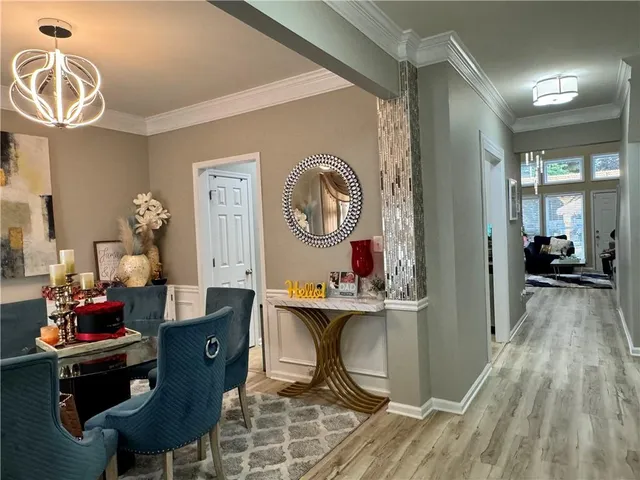 a living room with furniture and a mirror
