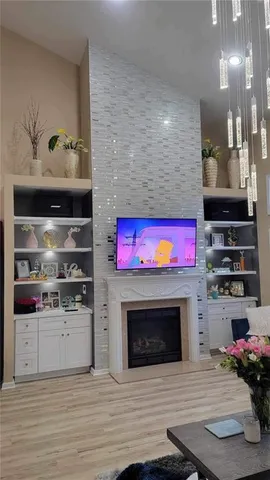 a kitchen with stainless steel appliances granite countertop a stove top oven and cabinets