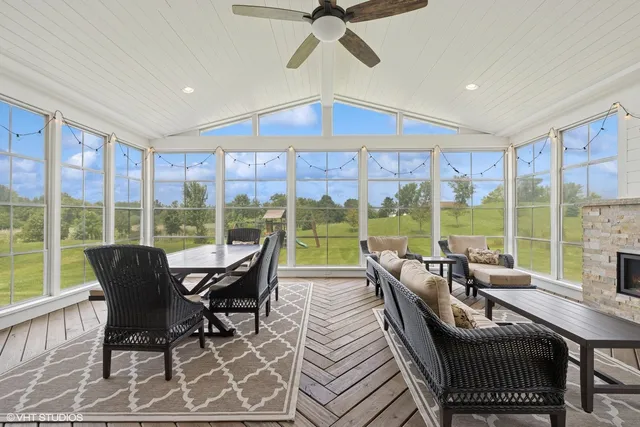 a dining room with furniture and wooden floor