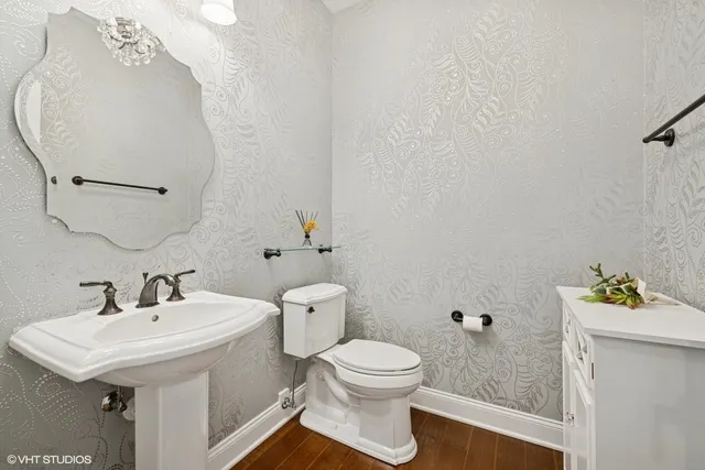 a view of an entryway with wooden floor