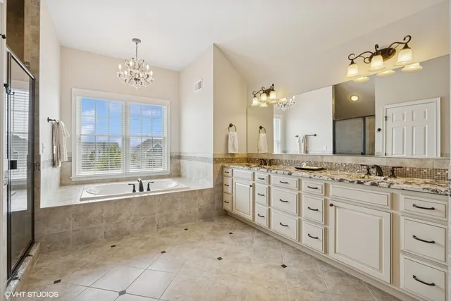 a bathroom with a bathtub and a shower