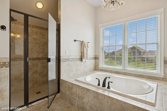 a bed room with a bed and a mirror