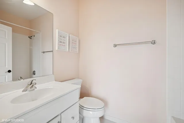 a kitchen with white cabinets and sink