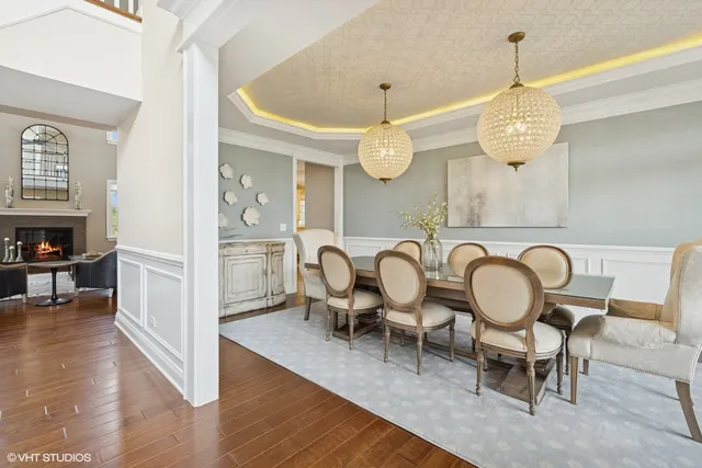 a large kitchen with a table and chairs
