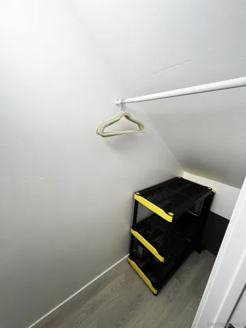 a bed room with a bed and a television