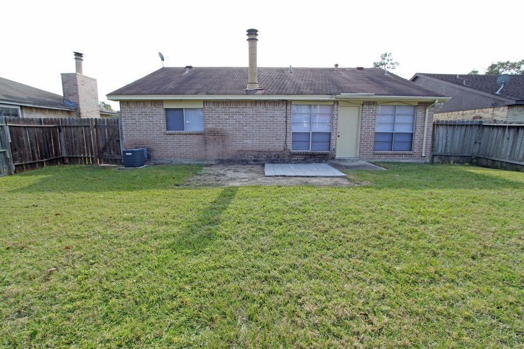 4627 Tealgate Drive Spring, TX 77373 - Photo 6 of 7 a view of a house with a yard and a large tree