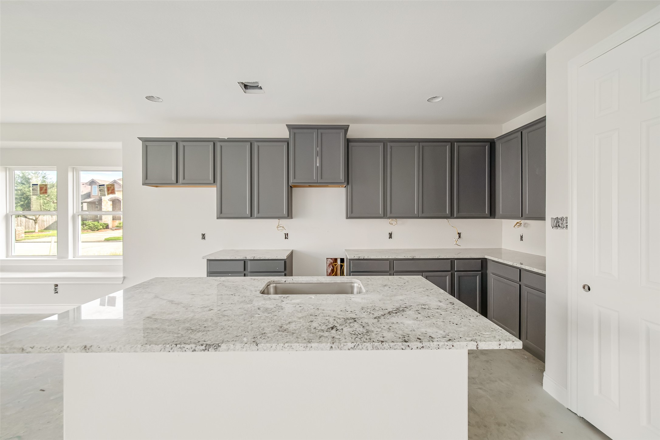 102 Par Circle La Porte, TX 77571 - Photo 8 of 24 a kitchen with granite countertop a sink stove and cabinets