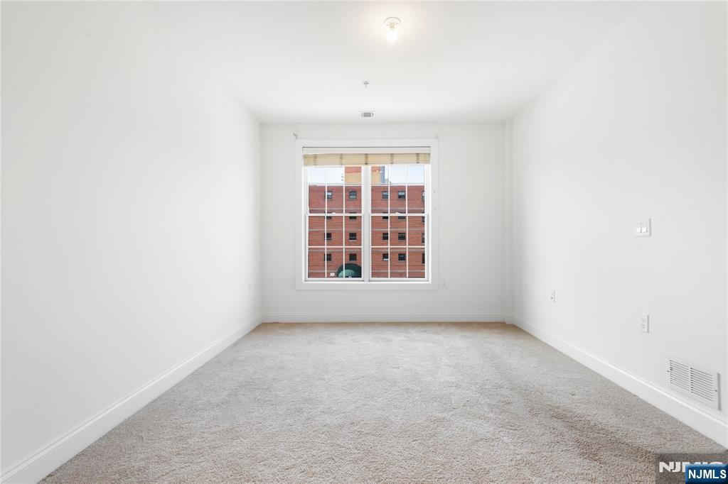 54 Polifly Road, Unit 311 Hackensack, NJ 07601 - Photo 13 of 20 a view of an empty room with a window