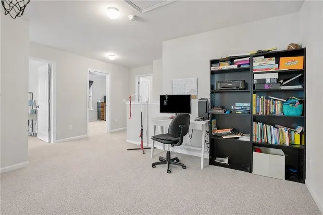 a view of a livingroom with furniture and a garage