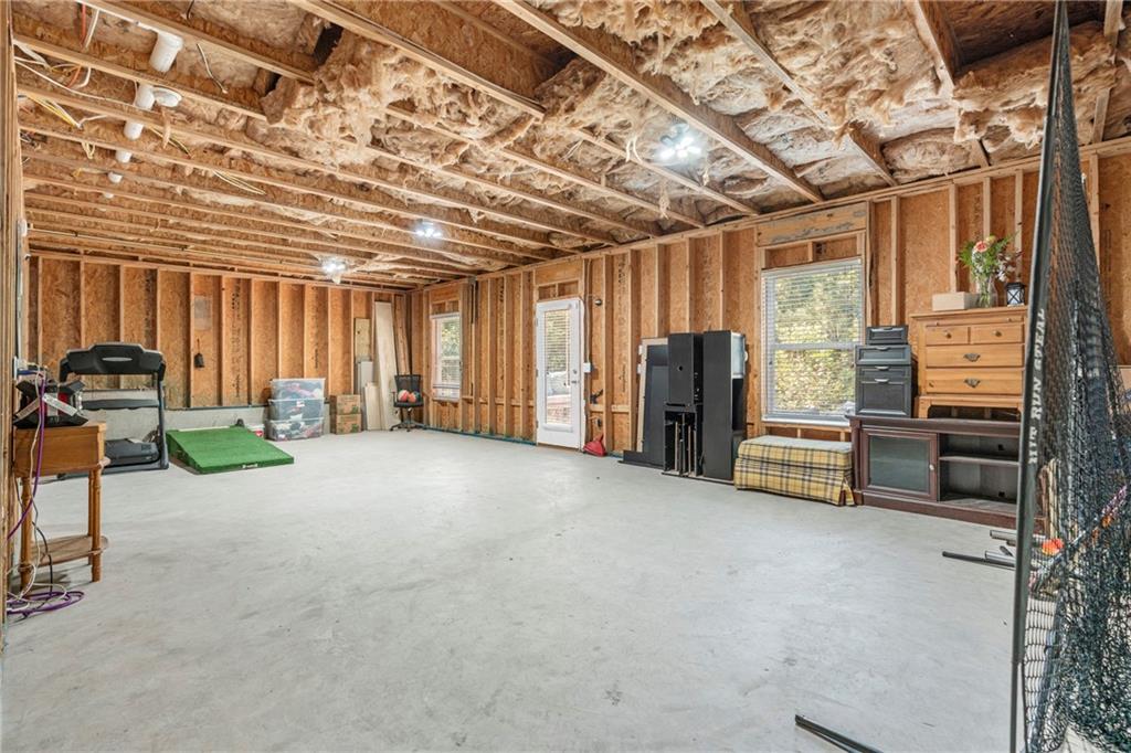 511 A Autumn Echo Canton, GA 30114 - Photo 25 of 39 a view of a livingroom with furniture and a garage