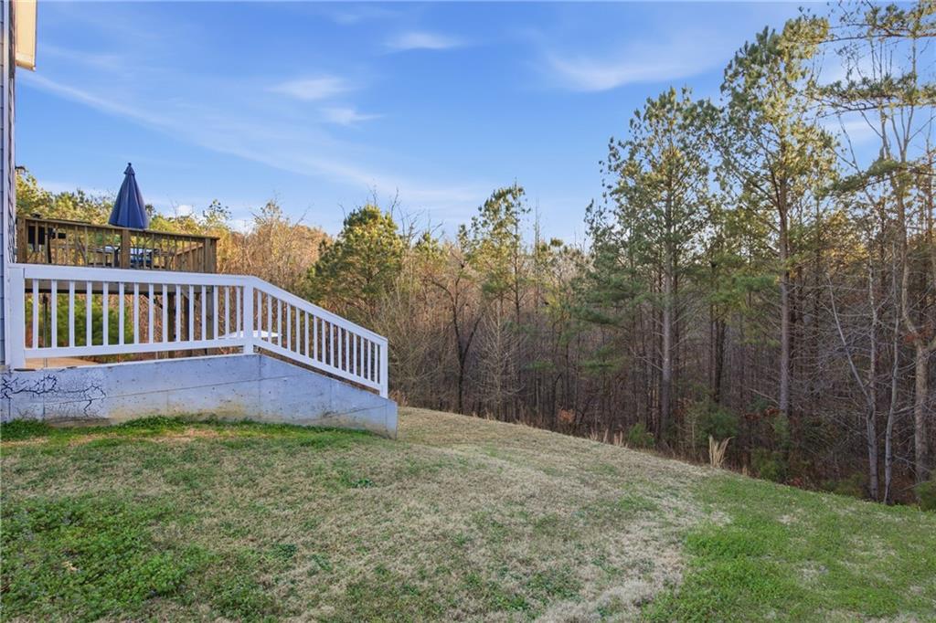511 A Autumn Echo Canton, GA 30114 - Photo 30 of 39 a view of a yard with wooden fence