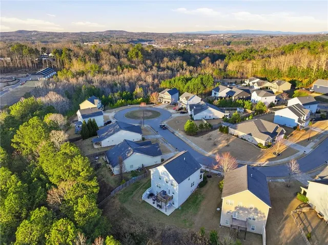 an aerial view of a house with mountain view