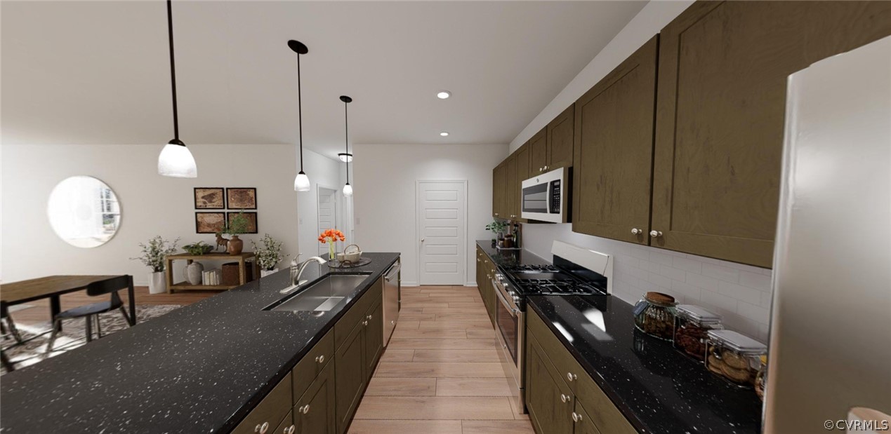 4107 Next Level Trace Midlothian, VA 23112 - Photo 11 of 39 a large kitchen with stainless steel appliances a large center island attached withe living room