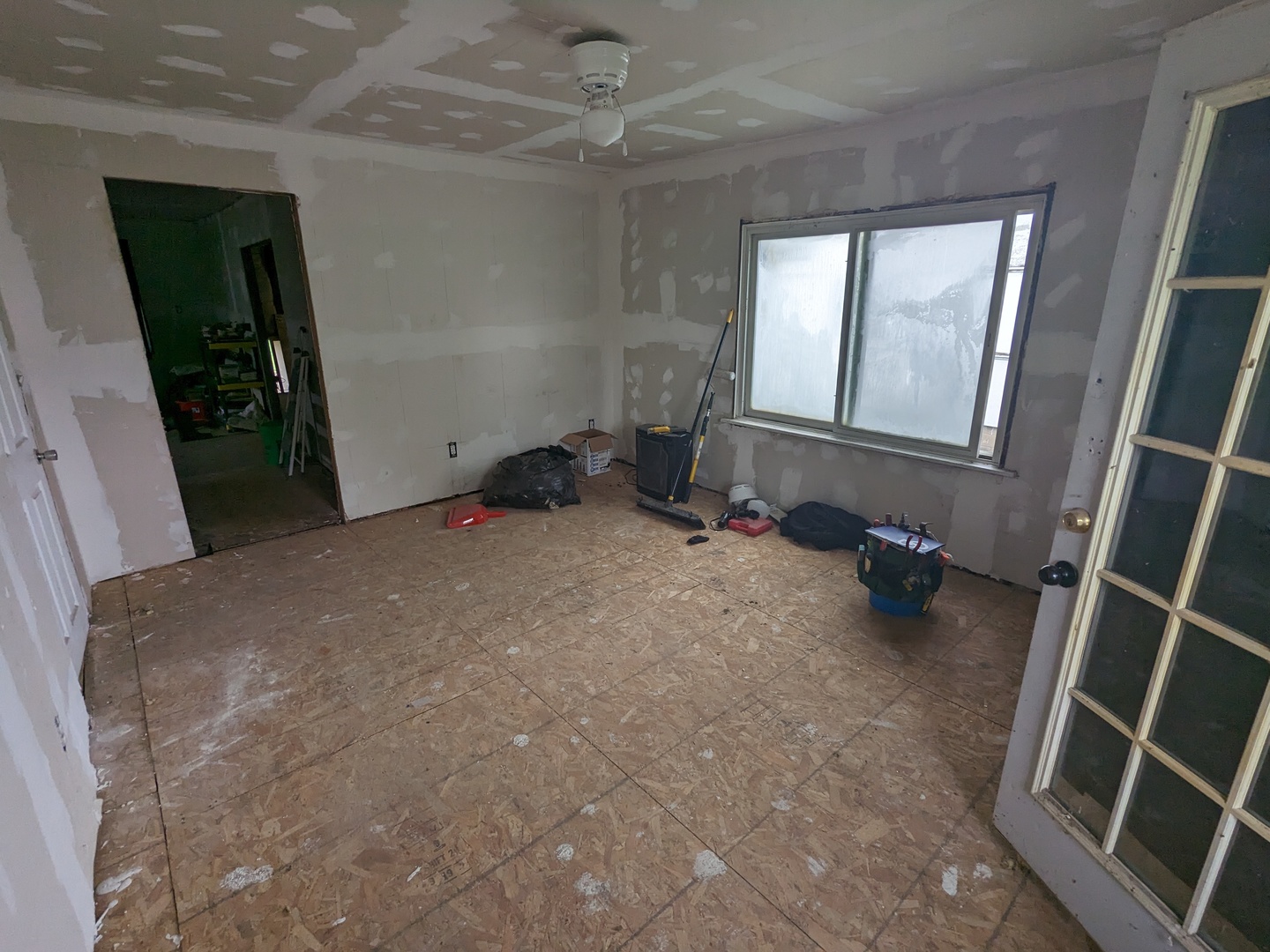 108 3rd Street Buckley, IL 60918 - Photo 8 of 23 a room with water heater and a wooden floor